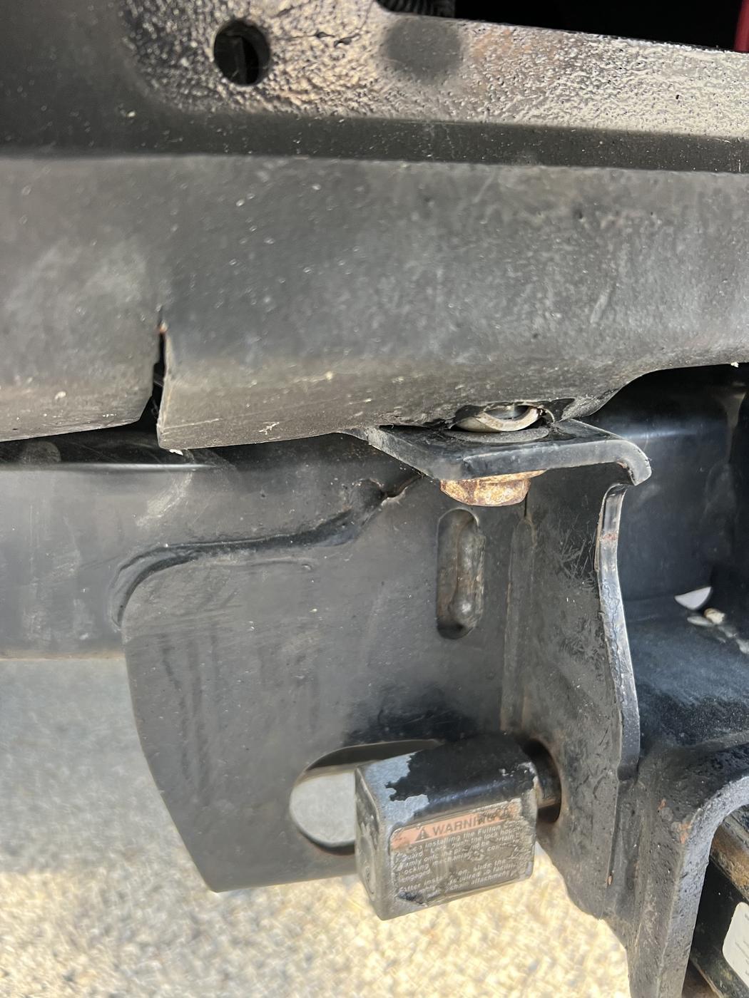 Close up of weld work around a trailer coupler and hitch